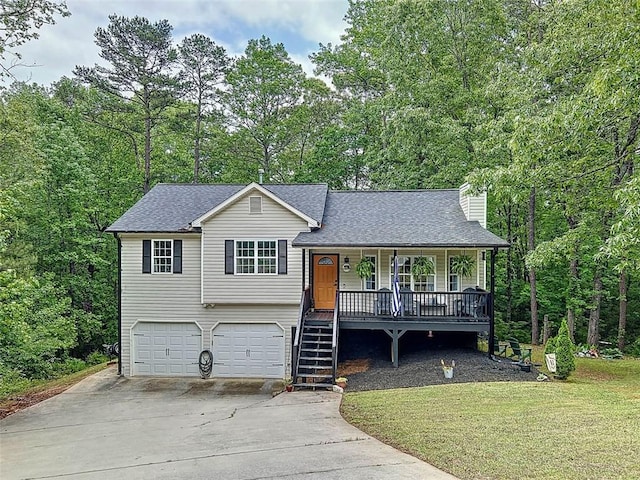 split level home featuring a garage, roof with shingles, a chimney, concrete driveway, and a porch