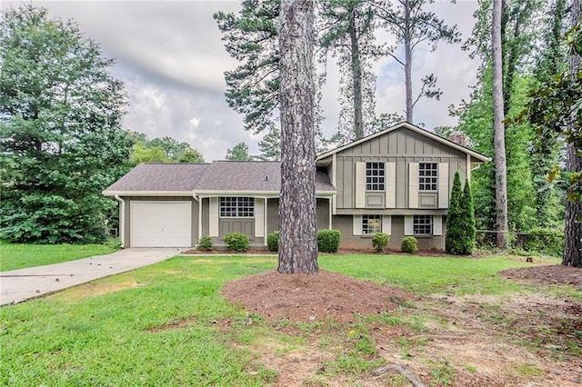 2110 Redbud Ct SW, Marietta, GA 30008 - tri-level home with brick siding, a garage, concrete driveway, a chimney, and a front yard