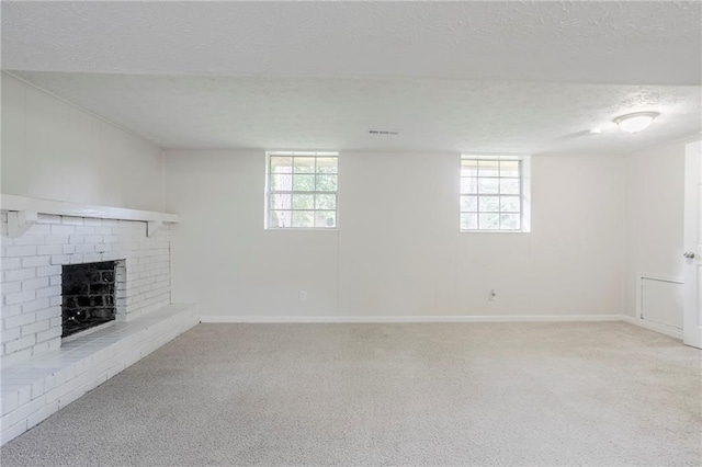 2110 Redbud Ct SW, Marietta, GA 30008 - below grade area with a textured ceiling, light carpet, and a fireplace