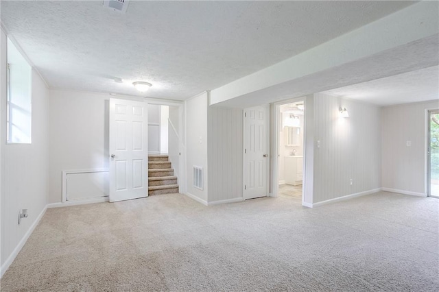 2110 Redbud Ct SW, Marietta, GA 30008 - below grade area featuring carpet floors, stairs, and a textured ceiling