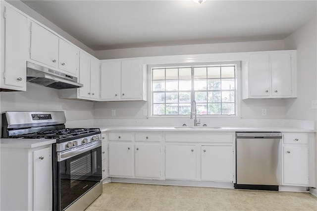 2110 Redbud Ct SW, Marietta, GA 30008 - kitchen featuring stainless steel appliances, under cabinet range hood, white cabinetry, and light countertops