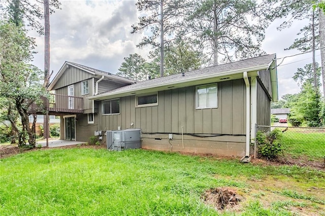 2110 Redbud Ct SW, Marietta, GA 30008 - back of house featuring board and batten siding and a patio area