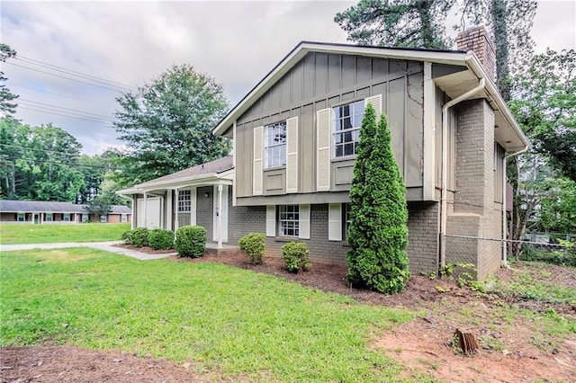 2110 Redbud Ct SW, Marietta, GA 30008 - tri-level home with brick siding, a chimney, and board and batten siding