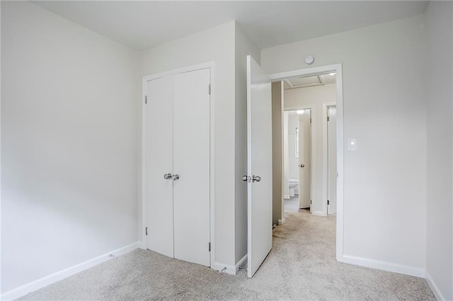 2110 Redbud Ct SW, Marietta, GA 30008 - unfurnished bedroom featuring carpet floors, attic access, and a closet