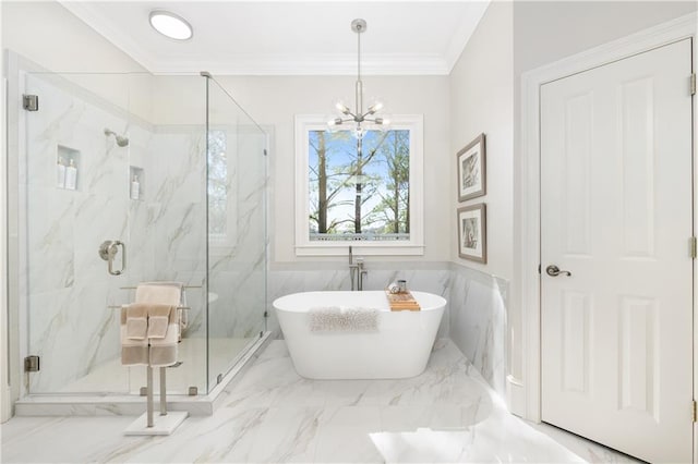 bathroom with a marble finish shower, a freestanding tub, marble finish floor, and crown molding