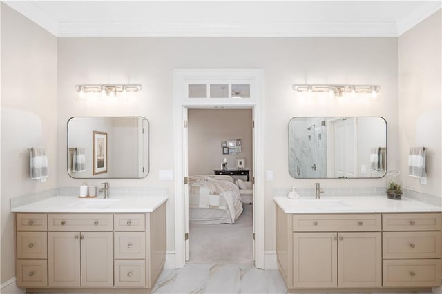 bathroom with a sink, marble finish floor, and ornamental molding