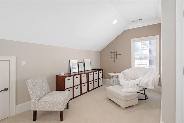 sitting room with vaulted ceiling, carpet, visible vents, and baseboards