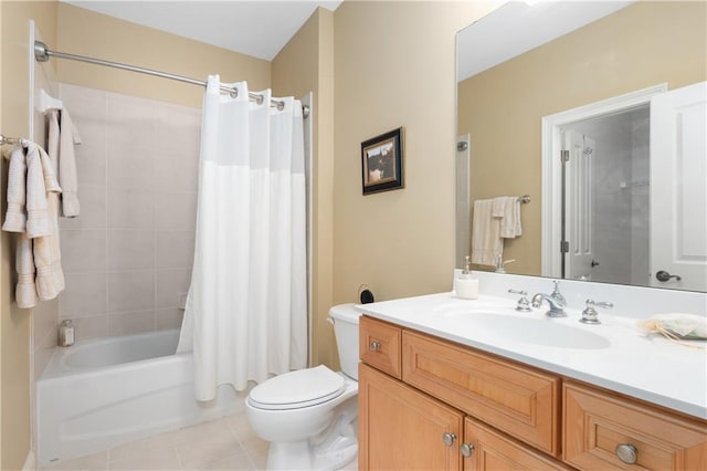 bathroom featuring vanity, tile patterned floors, toilet, and shower / bath combo