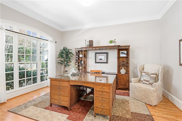 home office featuring baseboards, crown molding, and light wood-style floors