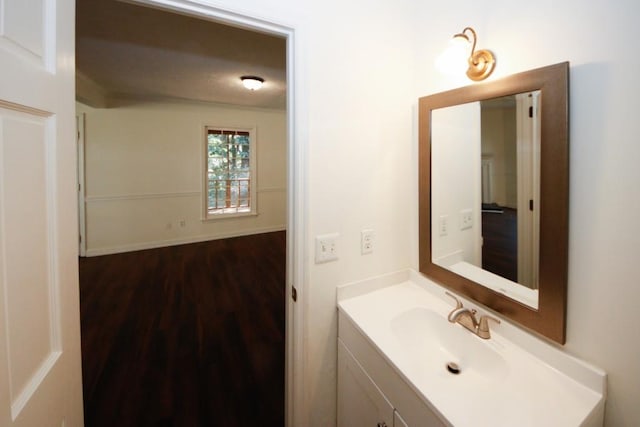 bathroom featuring hardwood / wood-style floors and vanity