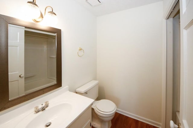 bathroom featuring hardwood / wood-style floors, vanity, and toilet