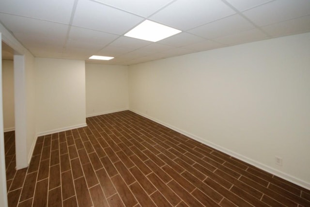 basement featuring a paneled ceiling