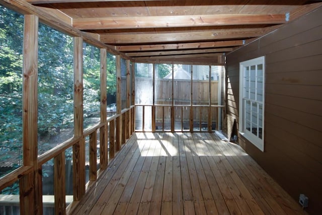 unfurnished sunroom with vaulted ceiling