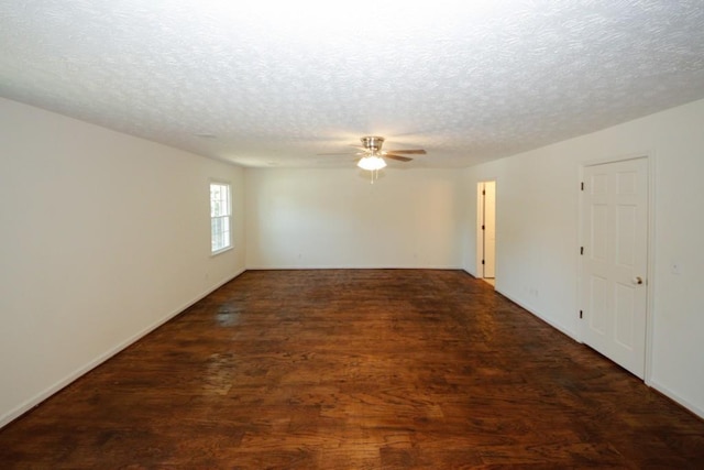 spare room featuring a textured ceiling, dark hardwood / wood-style floors, and ceiling fan