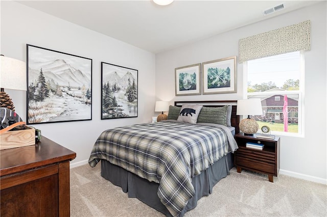 bedroom with light colored carpet