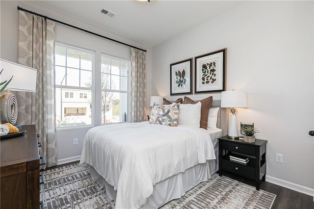 bedroom featuring dark hardwood / wood-style flooring