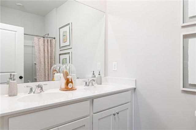 bathroom with walk in shower and vanity