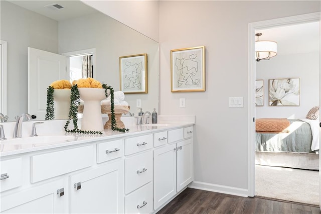 bathroom featuring vanity and hardwood / wood-style floors