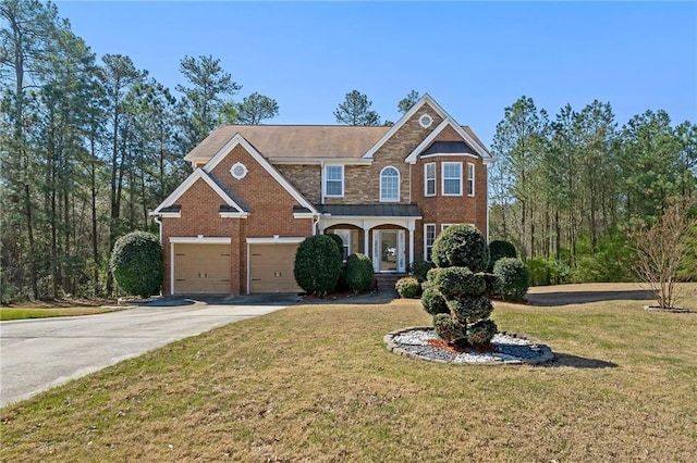 traditional home featuring driveway, brick siding, a garage, and a front yard