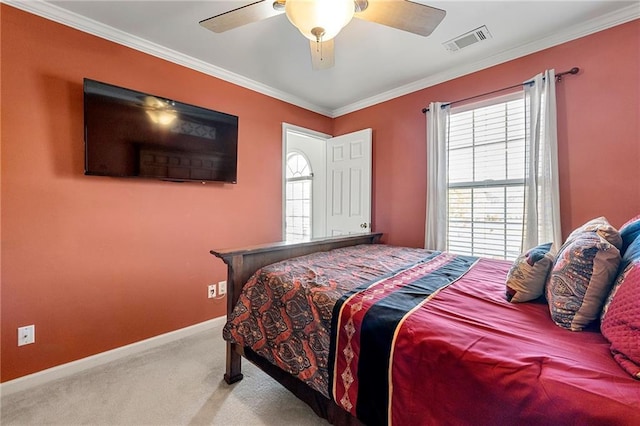 bedroom with baseboards, visible vents, ornamental molding, and carpet