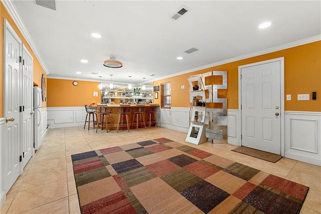 kitchen with visible vents, recessed lighting, a kitchen bar, and light tile patterned floors