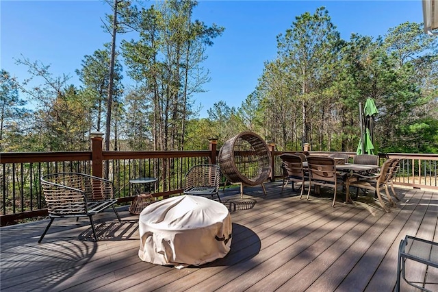 wooden deck with outdoor dining space