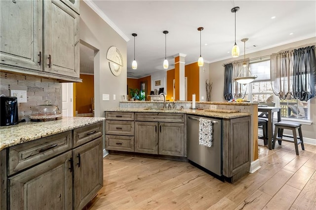 kitchen with decorative backsplash, ornamental molding, a sink, and dishwasher