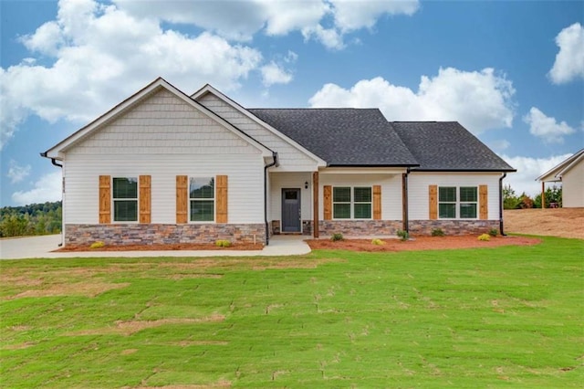 craftsman inspired home with a front yard