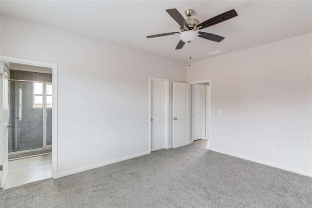 unfurnished room with ceiling fan and light colored carpet