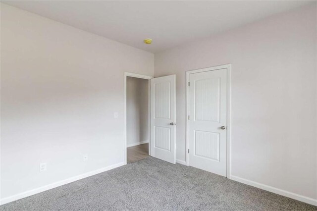 unfurnished bedroom featuring carpet