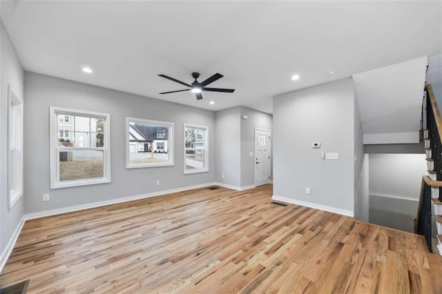 unfurnished living room featuring light wood-style floors, recessed lighting, visible vents, and baseboards