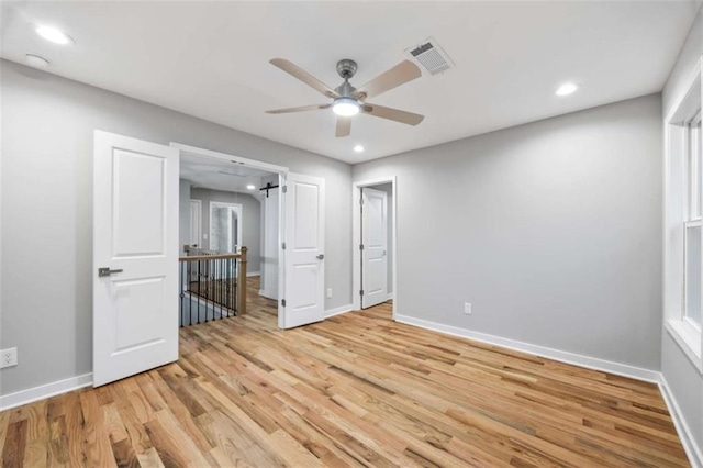 unfurnished bedroom featuring recessed lighting, baseboards, visible vents, and light wood finished floors