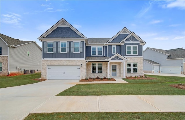 512 Dolce Rd, Locust Grove, GA 30248 - craftsman house featuring board and batten siding, a front lawn, driveway, and an attached garage
