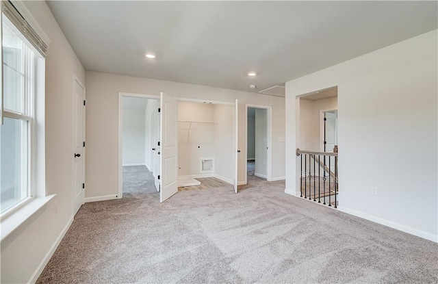 512 Dolce Rd, Locust Grove, GA 30248 - carpeted spare room with baseboards, a healthy amount of sunlight, and recessed lighting