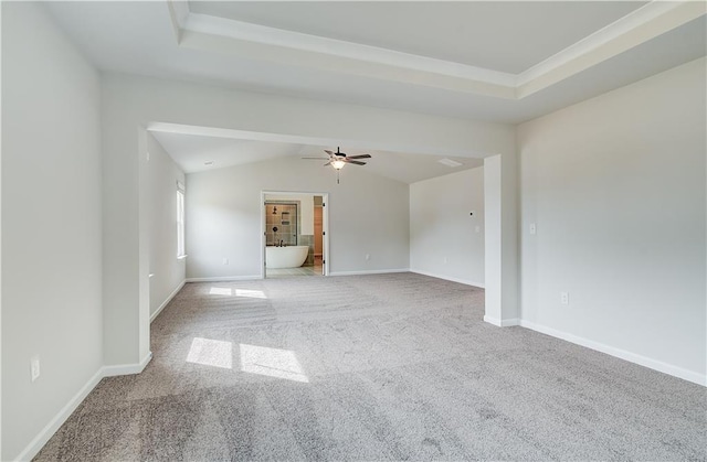 512 Dolce Rd, Locust Grove, GA 30248 - carpeted spare room featuring vaulted ceiling, baseboards, a ceiling fan, and a tray ceiling