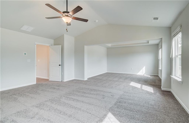 512 Dolce Rd, Locust Grove, GA 30248 - empty room featuring carpet flooring, vaulted ceiling, a ceiling fan, and visible vents