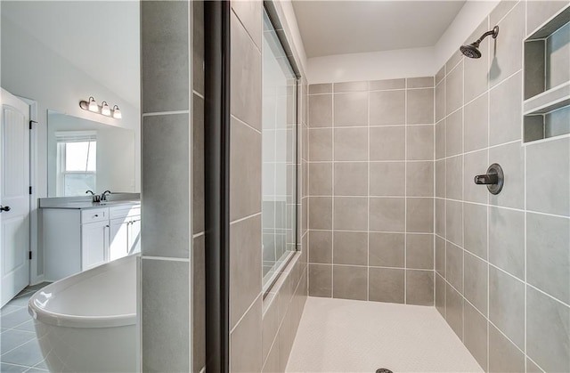 512 Dolce Rd, Locust Grove, GA 30248 - bathroom with a soaking tub, tile patterned floors, vanity, and tiled shower