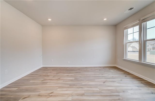 512 Dolce Rd, Locust Grove, GA 30248 - spare room with baseboards, light wood finished floors, and visible vents