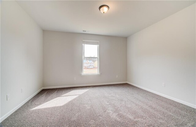 512 Dolce Rd, Locust Grove, GA 30248 - carpeted empty room featuring visible vents and baseboards