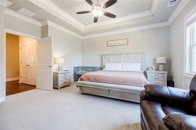 10035 River Rock Dr, Roswell, GA 30076 - bedroom featuring multiple windows, carpet floors, a raised ceiling, a ceiling fan, and ornamental molding
