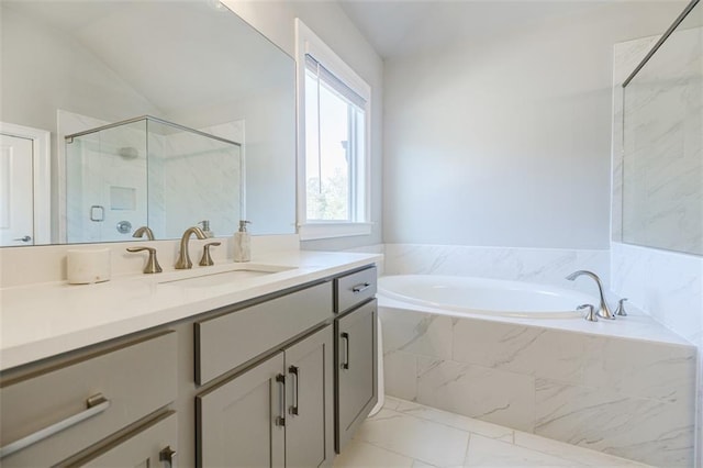 10035 River Rock Dr, Roswell, GA 30076 - full bathroom featuring a garden tub, a marble finish shower, vanity, lofted ceiling, and marble look tiles