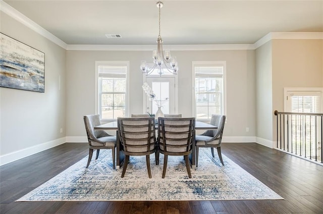 10035 River Rock Dr, Roswell, GA 30076 - dining room with healthy amount of natural light, a chandelier, crown molding, and dark wood finished floors