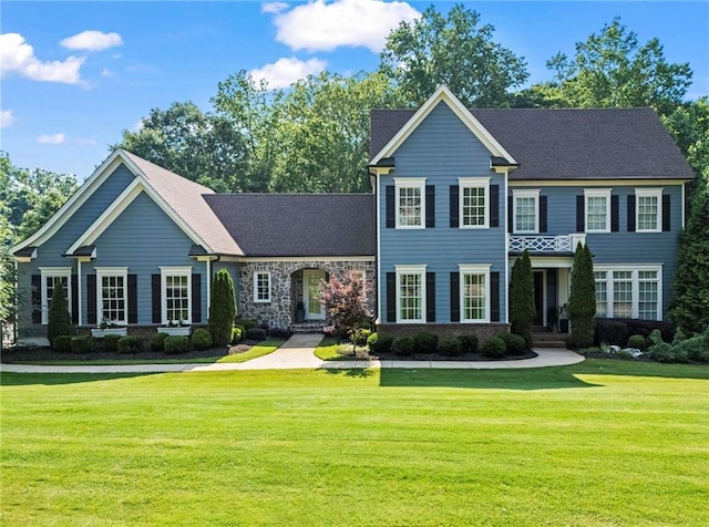 16045 Segwick Dr, Milton, GA 30004 - view of front of home with a front yard and a shingled roof