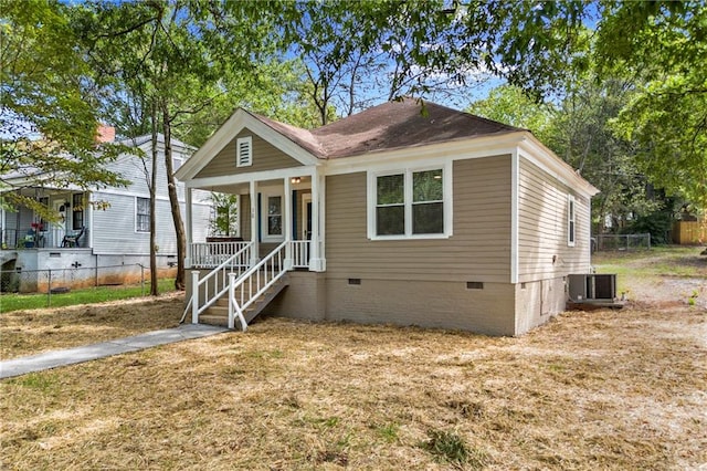 bungalow-style home with central AC unit and covered porch