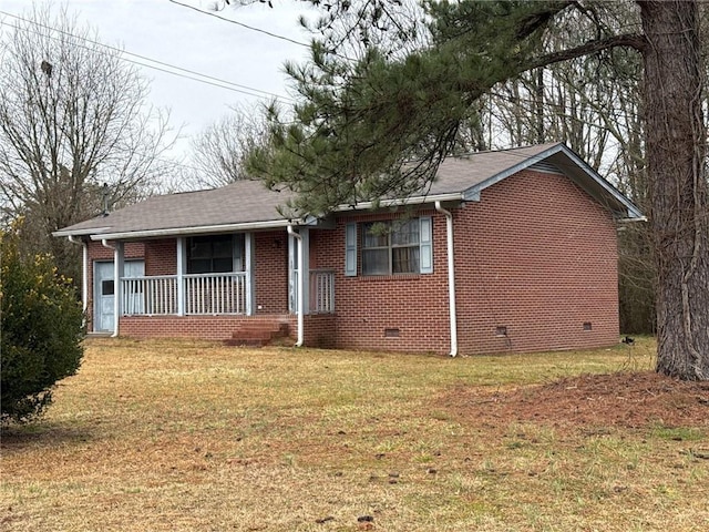 view of front of home with a front yard and covered porch