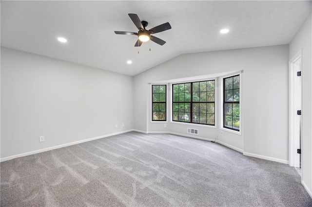 carpeted spare room with vaulted ceiling, baseboards, a ceiling fan, and recessed lighting