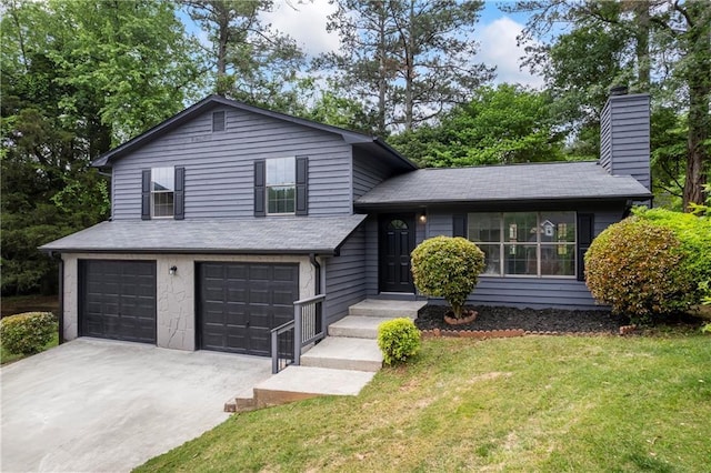 split level home featuring driveway, a chimney, a front yard, a garage, and a shingled roof