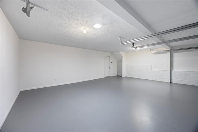 garage with baseboards