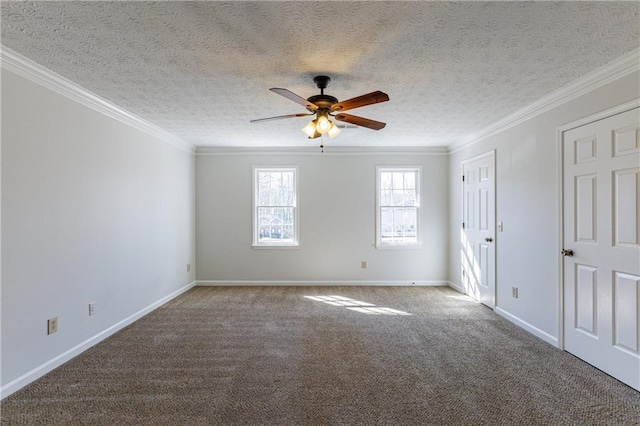 empty room featuring ornamental molding, carpet, a textured ceiling, and ceiling fan