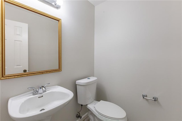 bathroom with sink and toilet